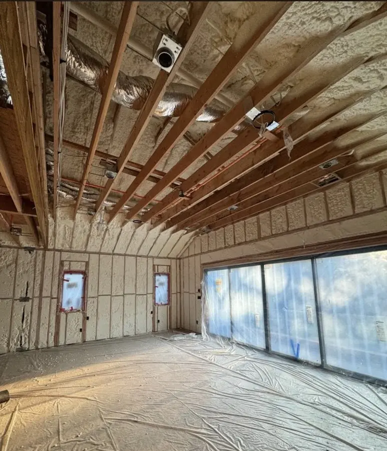 Interior walls and ceiling insulated with spray foam during new construction in Deerfield Beach